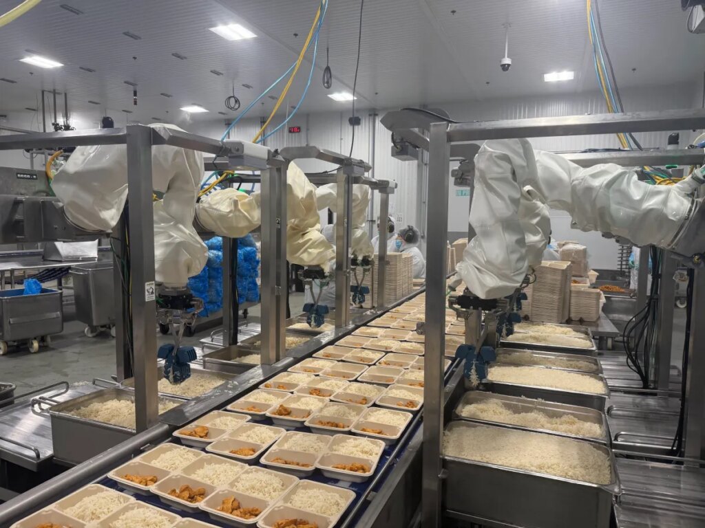 Chef robots deposit rice at Chef Bombay